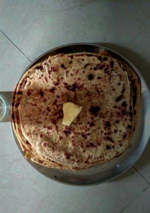 A picture of Aloo paratha and special lassi.