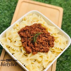 A picture of Jamaican style Corned beef x farfalle pasta.
