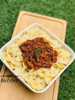 A picture of Jamaican style Corned beef x farfalle pasta.