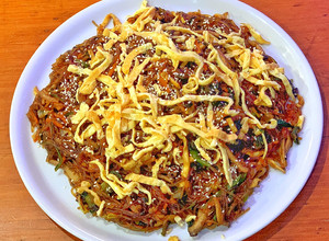 A picture of Japchae (Sweet potato starch noodles).