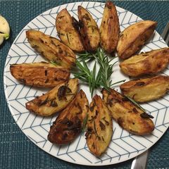 A picture of Roasted Potato With Fresh Rosemary And Garlic.