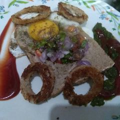 A picture of Multi grain bread with egg hole.