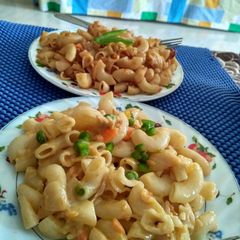 A picture of Cheese macaroni in white sauce.