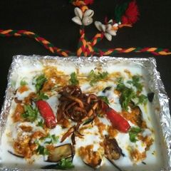 A picture of Sliced brinjal in curd.