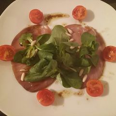 A picture of Smoked tuna carpaccio salad.