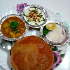 A picture of Sabji, kachori and boondi raita.