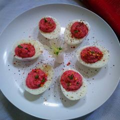 A picture of Deviled Eggs with Beetroot Hummus.