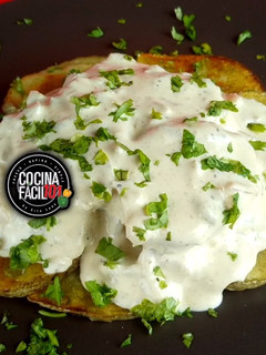 Una foto de Papas Bravas Parmesana