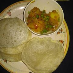 A picture of Luchi aloo Dom (Puri and dum aloo).