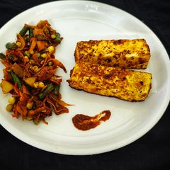 Peri Peri Paneer Steak with Tossed Vegetables A picture of Peri Peri Paneer Steak with Tossed Vegetables.