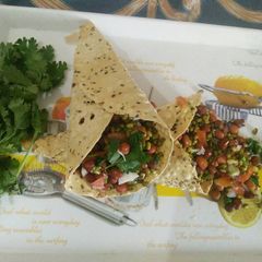A picture of Sprouts bhel with papad cone.