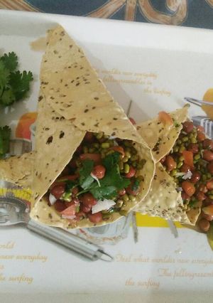 A picture of Sprouts bhel with papad cone.