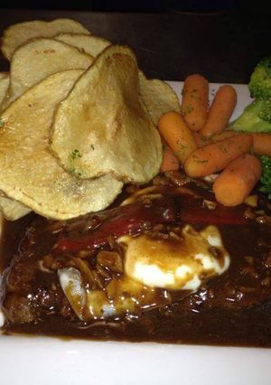 A picture of Portuguese Steak/hand cut fries/steamed veggies.