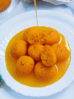 অরেঞ্জ ফ্লেভারড রসগোল্লা (Orange flavored rasgulla recipe in Bengali) রেসিপির প্রধান ছবি