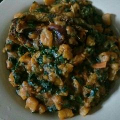 A picture of Unripe plantain with vegetable and dry fish.