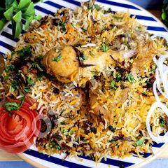 Authentic Hyderabadi Kachchi Yakhni Chicken Dum Biryani A picture of Authentic Hyderabadi Kachchi Yakhni Chicken Dum Biryani.