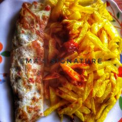 French Fries with roll fried eggs A picture of French Fries with roll fried eggs.
