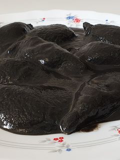 Una foto de Chipirones en su tinta