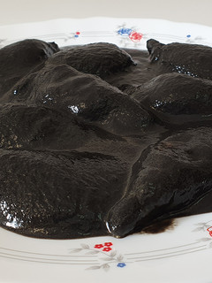 Una foto de Chipirones en su tinta
