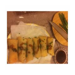 A picture of Chinese •Spring rolls• with sweet sauce.