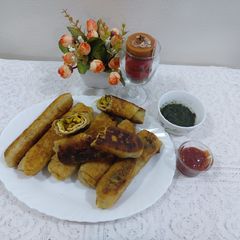 A picture of Bhuna chicken egg rolls.