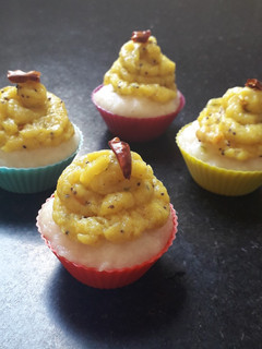 A picture of Rava idli cup cake with masala aloo frosting.