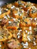 Merluza y butifarra de huevo en salsa almendras y azafrán