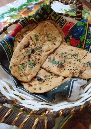 A picture of Wheat flour naan with deggi korma.