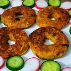 A picture of Potato doughnuts with leftover soup.