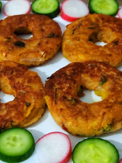 A picture of Potato doughnuts with leftover soup.