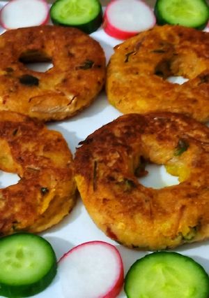 A picture of Potato doughnuts with leftover soup.