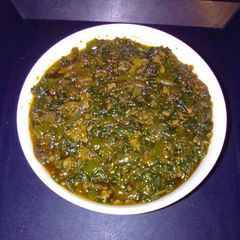 A picture of Spinach with chicken livers.