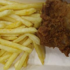 A picture of French fries with Fried Chicken.
