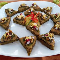 A picture of Healthy bites with dabeli topping.
