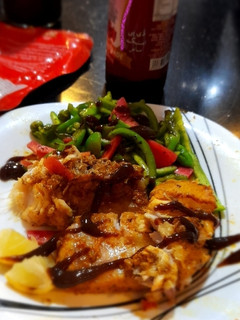 A picture of Fish steak with veggies.