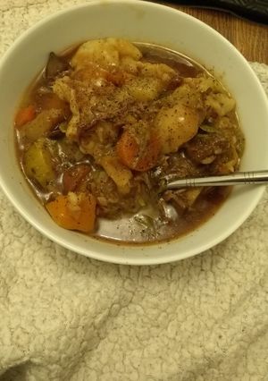 A picture of Mutton stew with homemade dumplings.