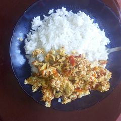 A picture of Fried eggs and rice.
