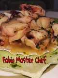 Tentacoli di Calamari all'Acqua Pazza serviti su Conchiglia