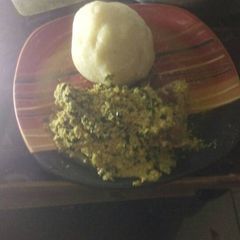 A picture of Egusi soup with garri.