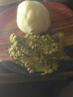 A picture of Egusi soup with garri.