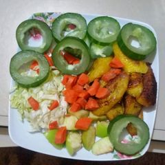 A picture of A mixture of fruit and fried plantain.