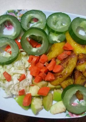 A picture of A mixture of fruit and fried plantain.