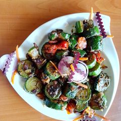 A picture of Zucchini pickle sabzi 🍅🧅.