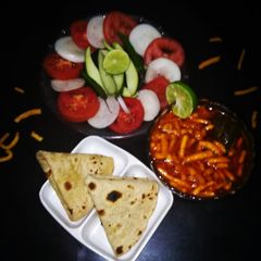 A picture of Sev sabji with wheat roti.
