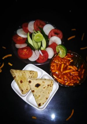 A picture of Sev sabji with wheat roti.