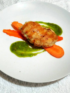 A picture of Grilled Crusted Chicken with Steeped spiced carrot and Green sauce.