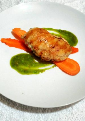 A picture of Grilled Crusted Chicken with Steeped spiced carrot and Green sauce.
