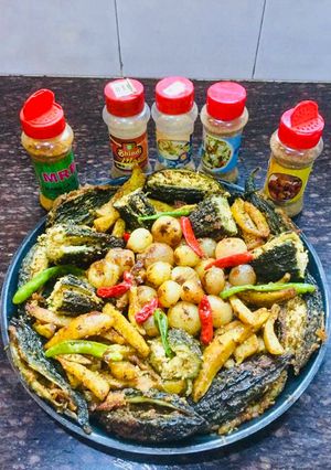 A picture of Paneer Bharwa Bitter gourds & Masala Bharwa Onions.