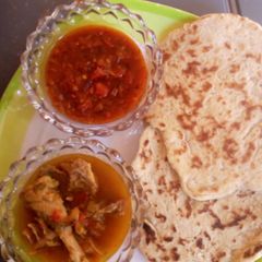 NAAN bread with souce and pepper soup A picture of NAAN bread with souce and pepper soup.