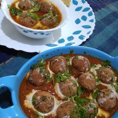 A picture of Paneer kofta in tomato gravy.